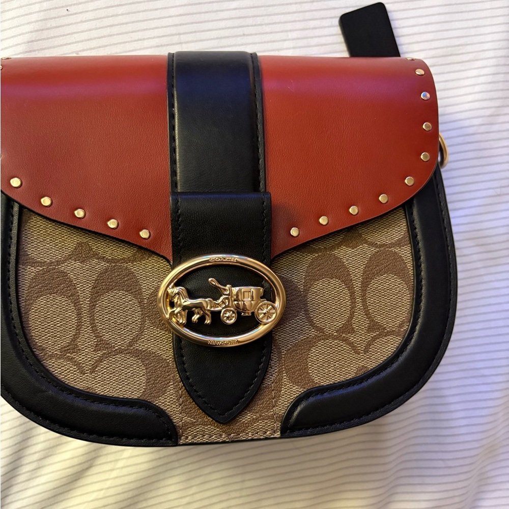 COACH Georgie Saddle Crossbody Bag colorblock signature canvas with rivets.